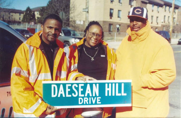 A.T. Mitchell-Mann with community members at Daesean Hill Drive